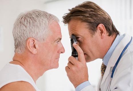 Eye doctor examines a patient's vision