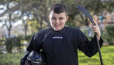Evan, 8, loves to play hockey.